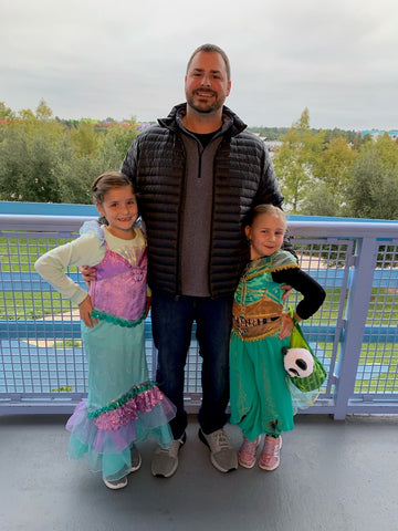 George and his daughters on a trip to Disney World