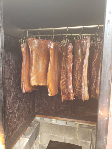 bacon hanging in Stoltzfus Meats smoker