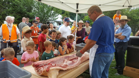 Myron Stoltzfus doing a butchering demonstration