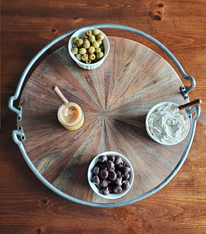 olives, spreads, and wilbur buds on a charcuterie board