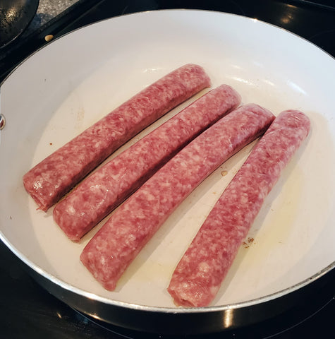 Stoltzfus Meats sausage grillers in a skillet