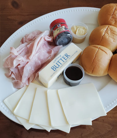 Baked Ham & Cheese Sliders ingredients on a plate ready for assembly