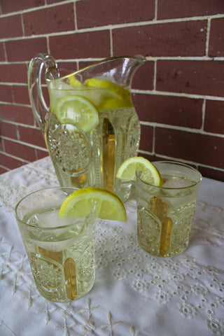 Pitcher of meadow tea with lemon