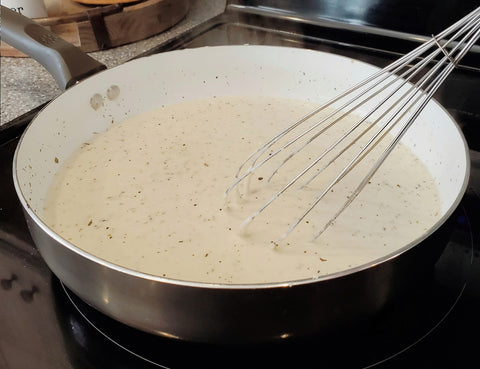 cooking alfredo sauce