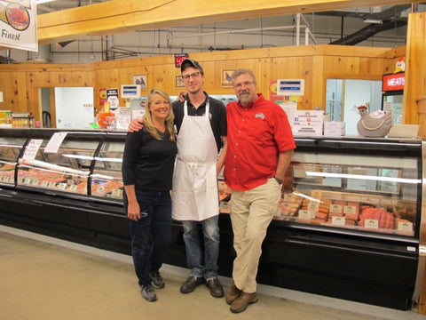 Sally, Zach, and Myron at the Poultry stand