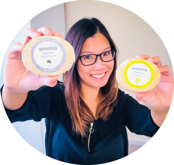 Elaine holding a tea tree shampoo bar and a lemon shampoo bar