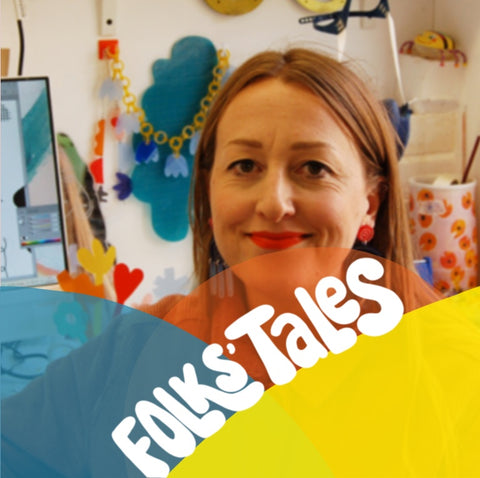 An image of Julia De Klerk in her workspace, with the words 'Folks Tales' superimposed over her face