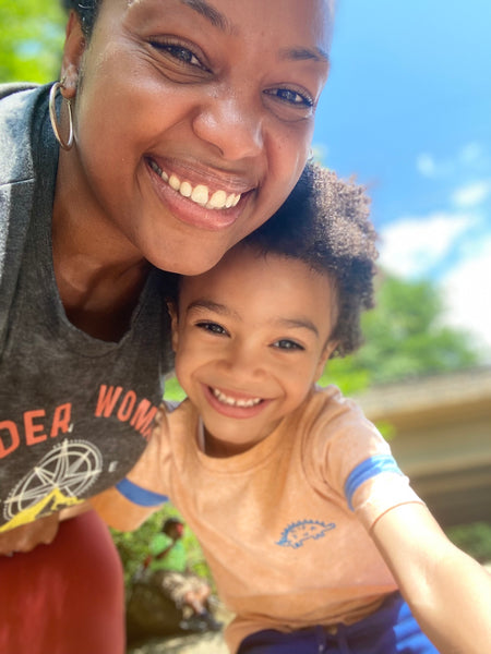 Mom and son hiking happily