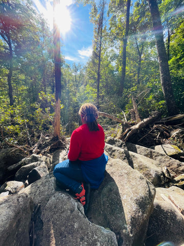 Black woman admiring nature while hiking