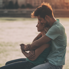 Couple sitting happily talking to each other