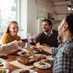 Group of friends having dinner and wine together