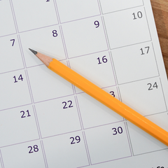 calendar with pencil over it for marking when your period arrives, which may be less regular during perimenopause