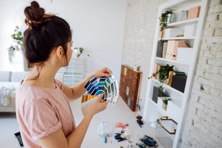 Interior designer selecting color in client's home