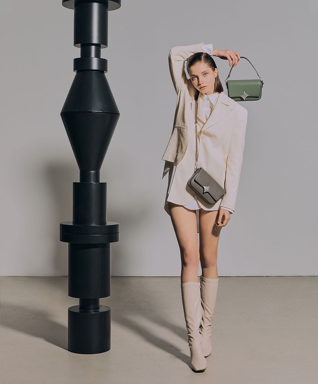 MODEL WEARING Elena Leather Crossbody Bag available color Jade Green and Stone Gray by Oryany - future Brands Group