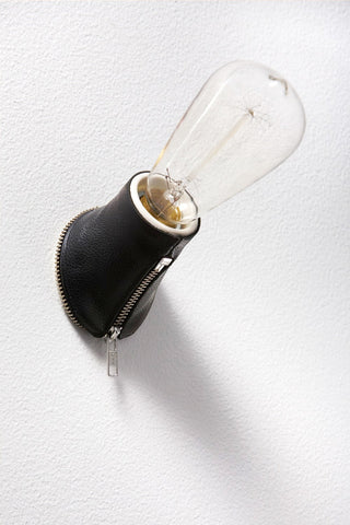 Black Tom Tom light with zipper detailing by Volker Haug and Santha King