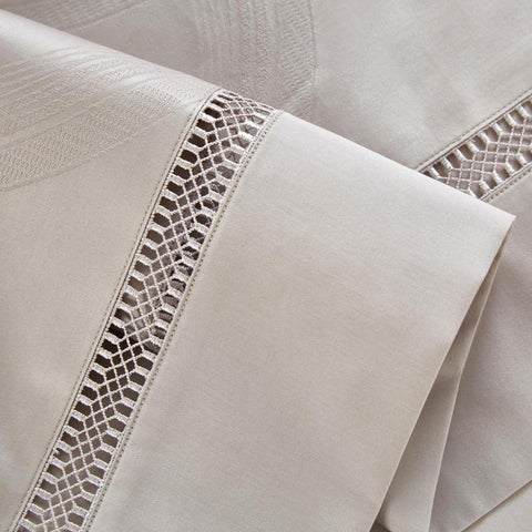 Cream jacquard bedding sheets.