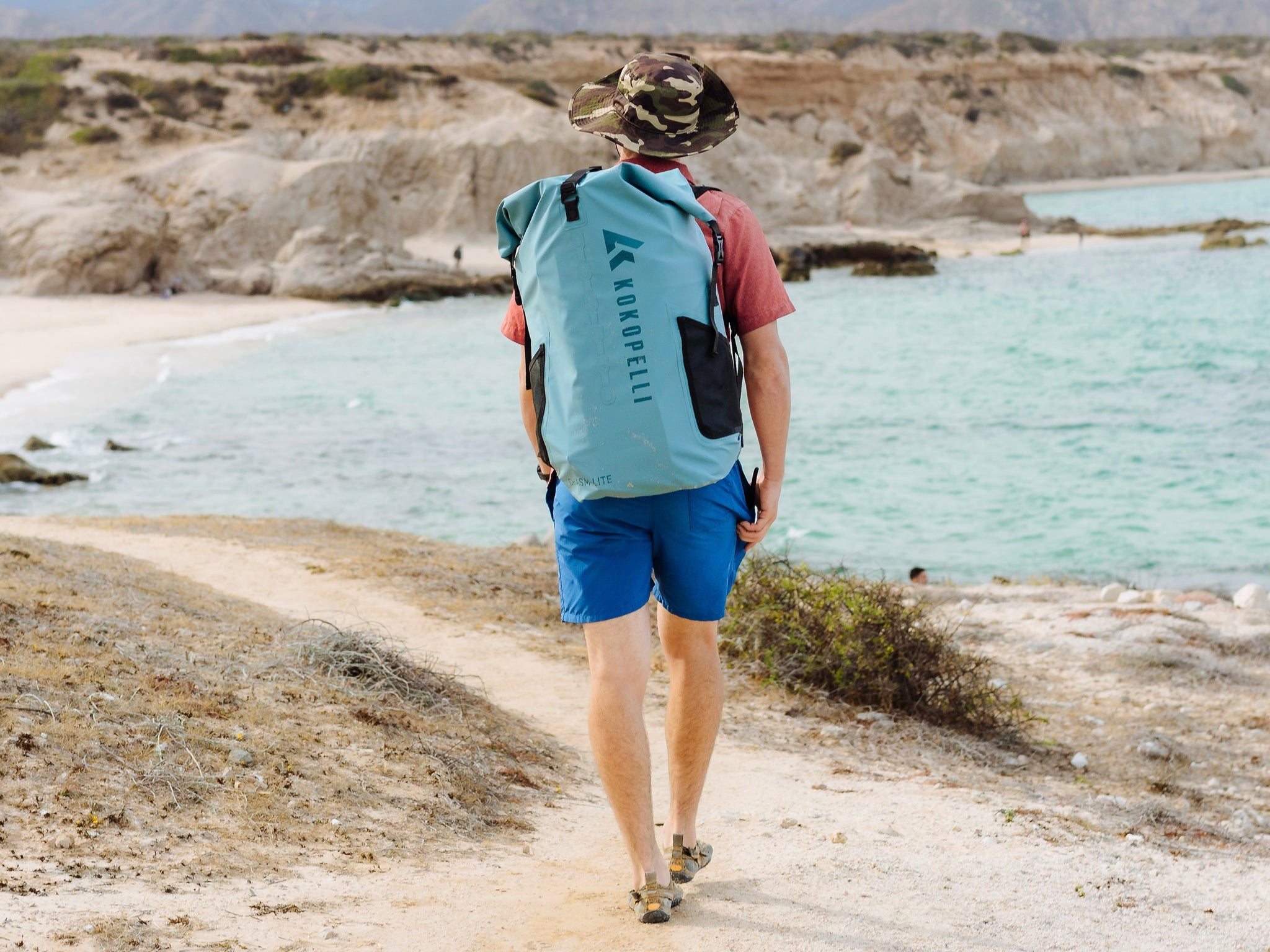 Hiking with the Chasm Lite SUP in a waterproof drybag backpack