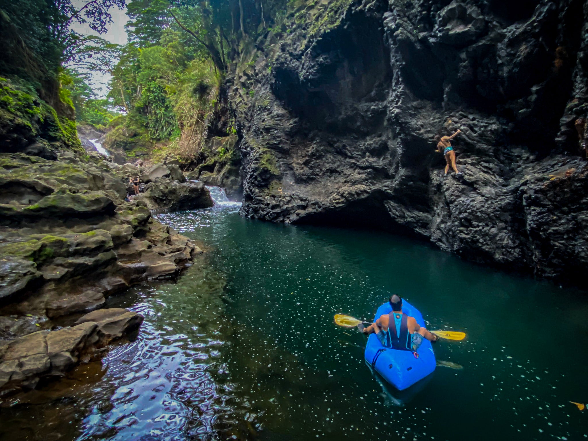 Packrafting in hawaii and rock climbing above the water