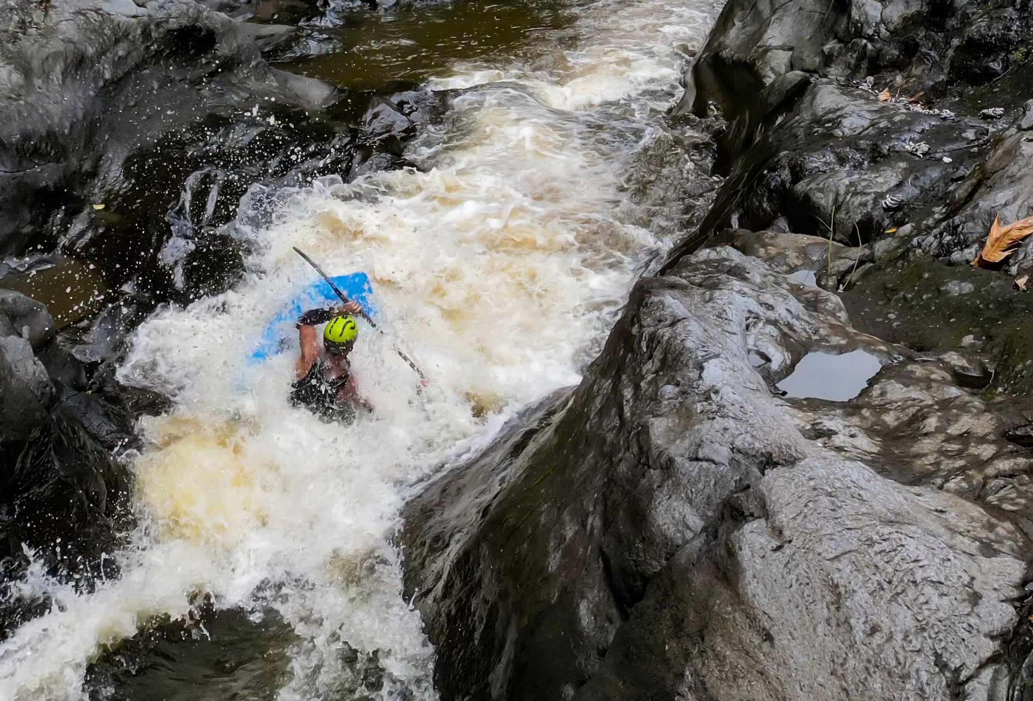 Eric Bergdoll Packrafting Hawaiian waterfalls in his Kokopelli Recon Self Bailing Packraft