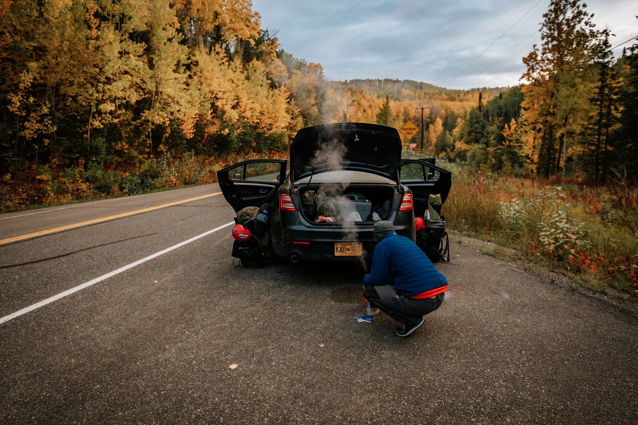 Tyler Stalling cooking dinner along the highway