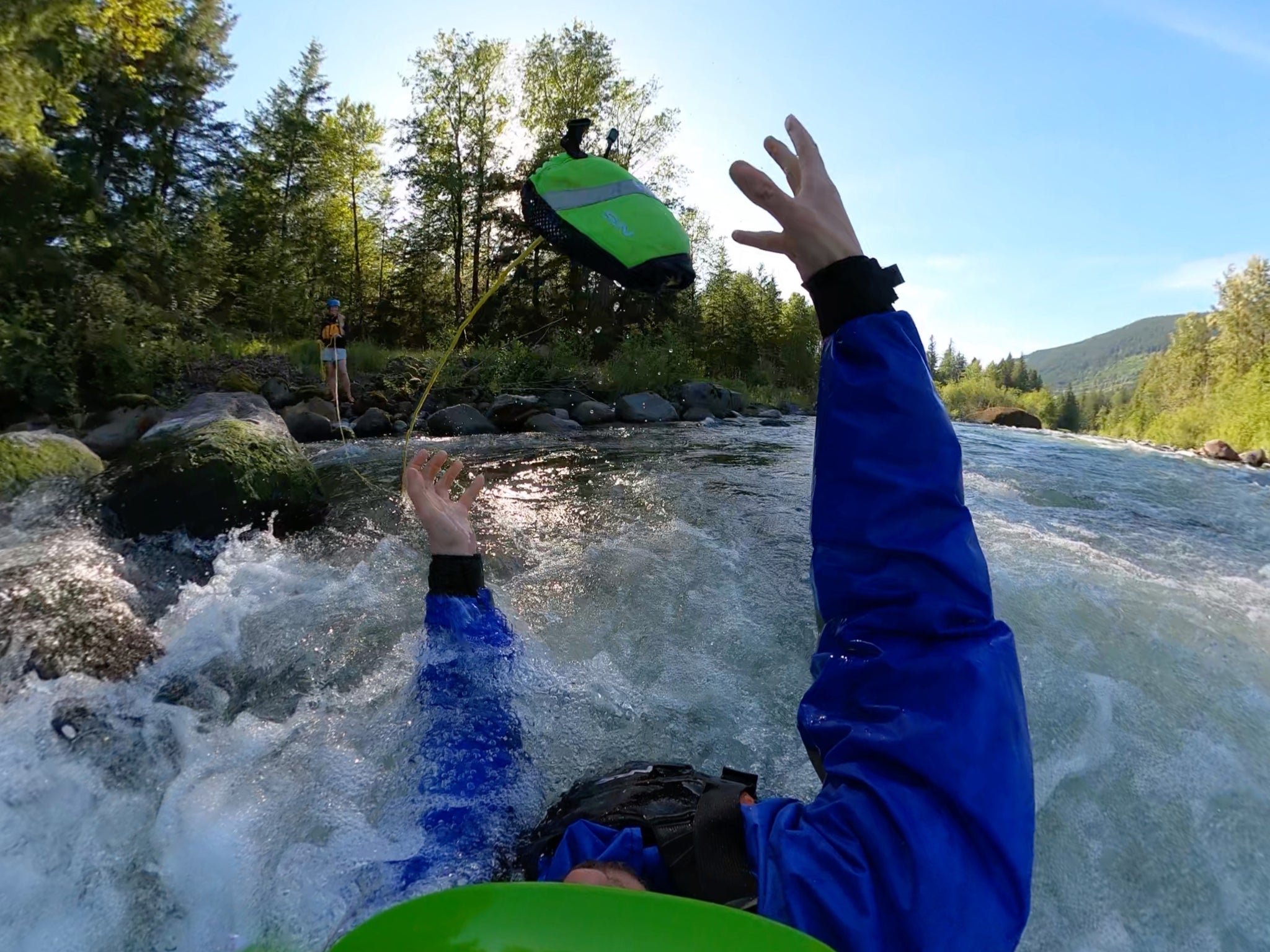 Catching a throw bag during a swift water rescue course