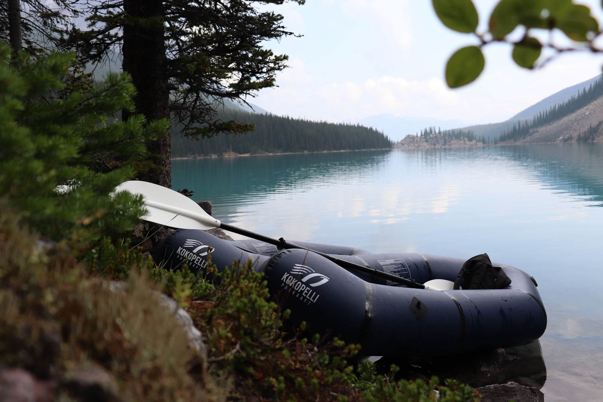 Packrafts docked by a lake. Why the Hornet Life Kokopelli Packraft is for you