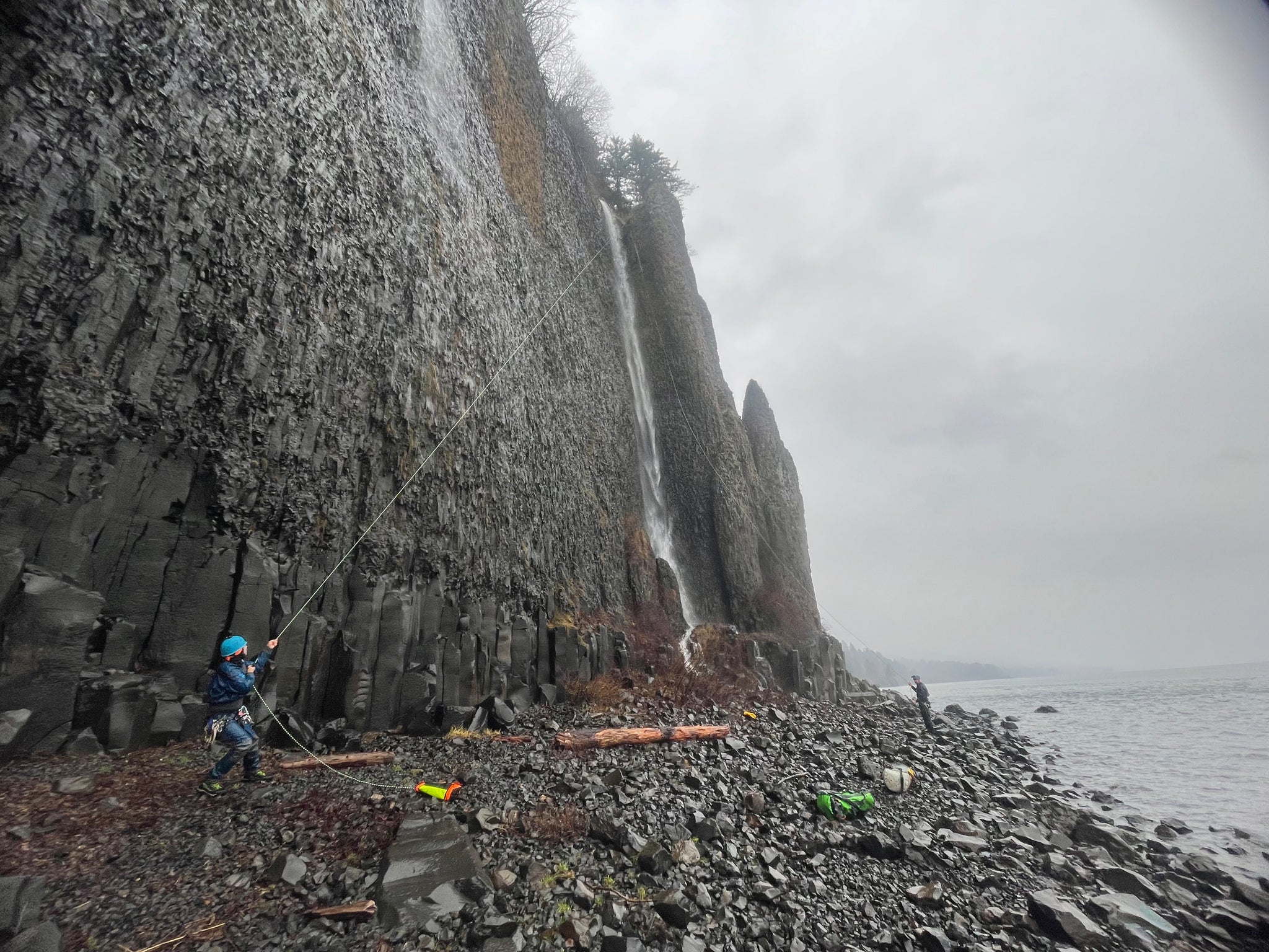 Pulling the rope at the bottom of the waterfall