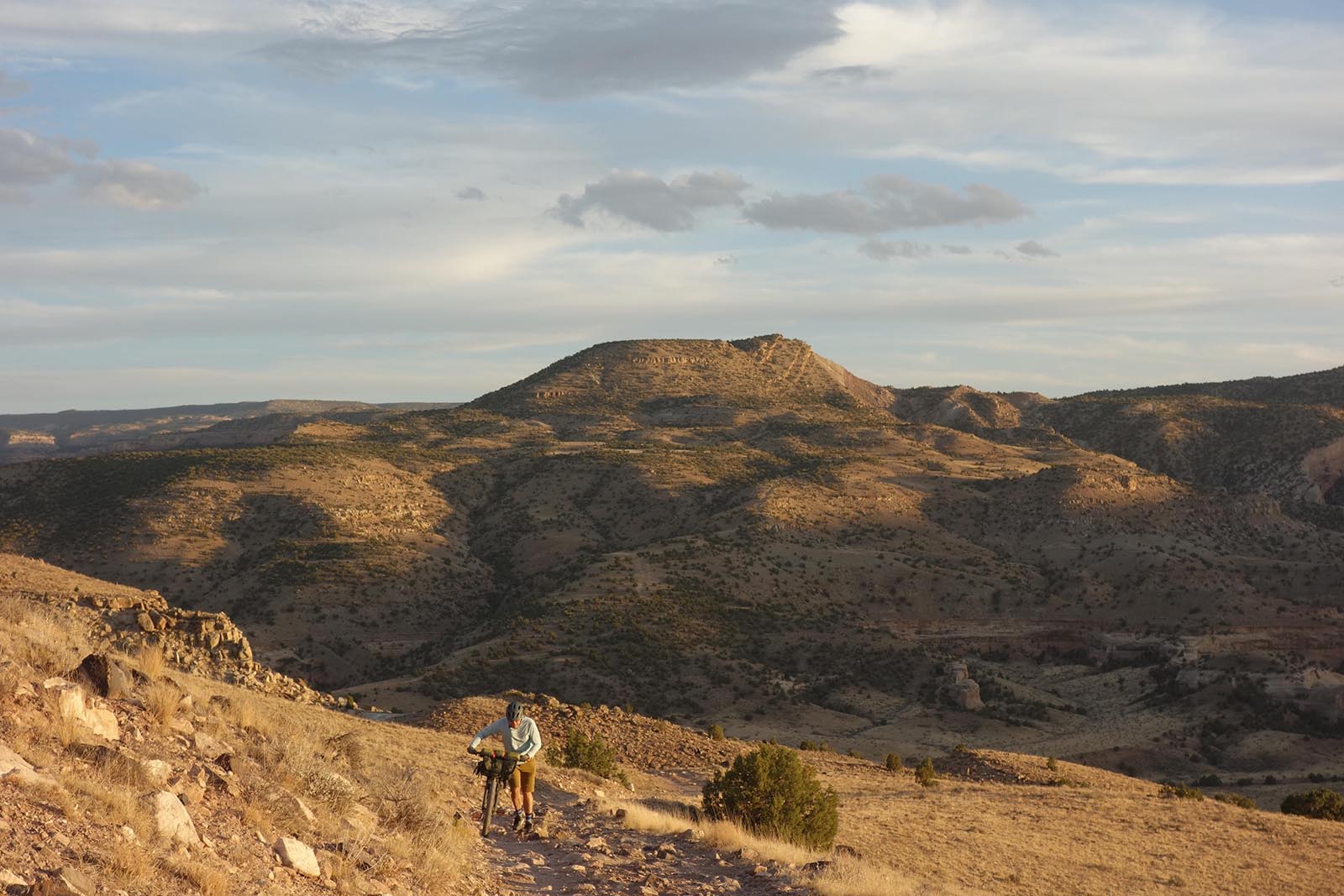 Bikerafting the American West - Cyclist walking his bike up the Kokopelli Trail