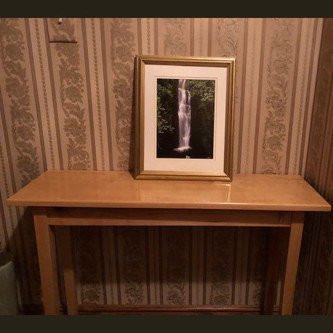 Maple console table with picture frame on display
