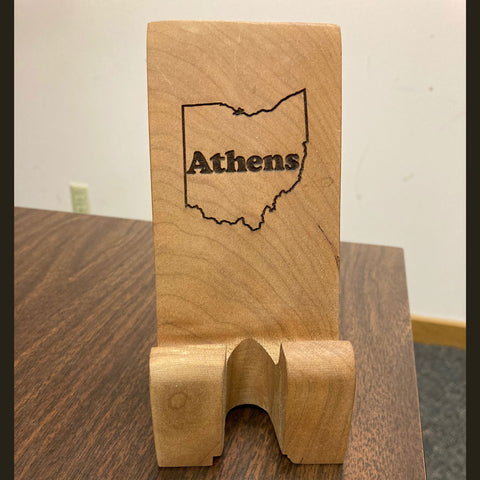 Hand crafted phone stand from fallen cherry, outline of Ohio with the word Athens in center design