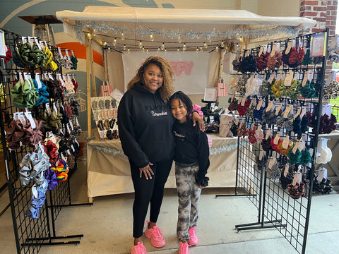 The CEO Katrina McConnell and her daughter displaying how much the Fluffy Scrunchies team is all about comfort.  Wearing hoodies, leggings and sneakers.