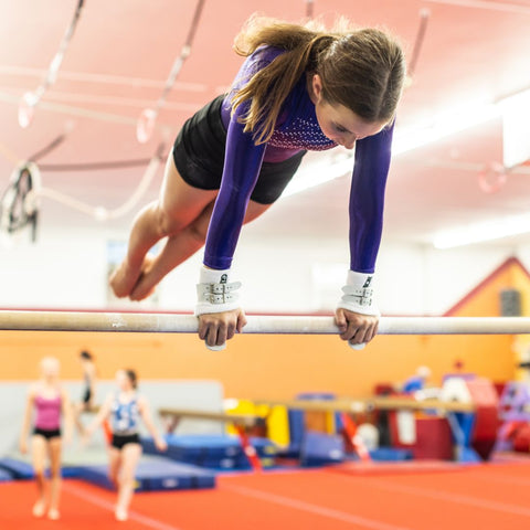 girl on uneven bars