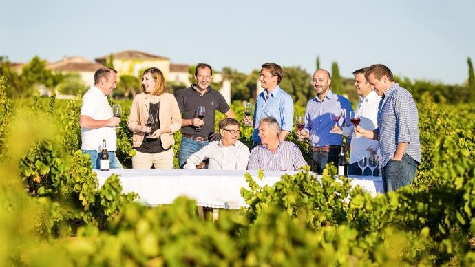 The Perrin family enjoying a glass of wine outdoors