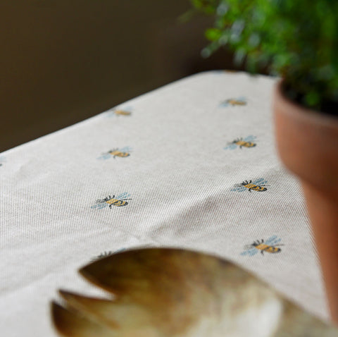 Bee oilcloth on a kitchen table
