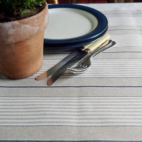 Blue striped oilcloth covering a kitchen table
