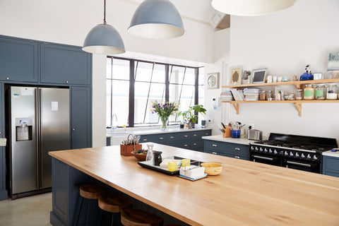 ALT="Dark blue painted kitchen cupboards"