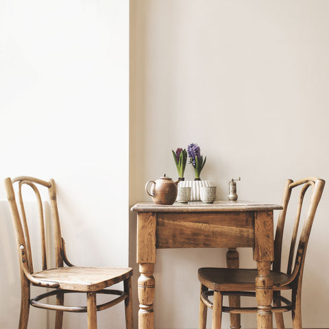 alt="vintage wooden chairs and table"