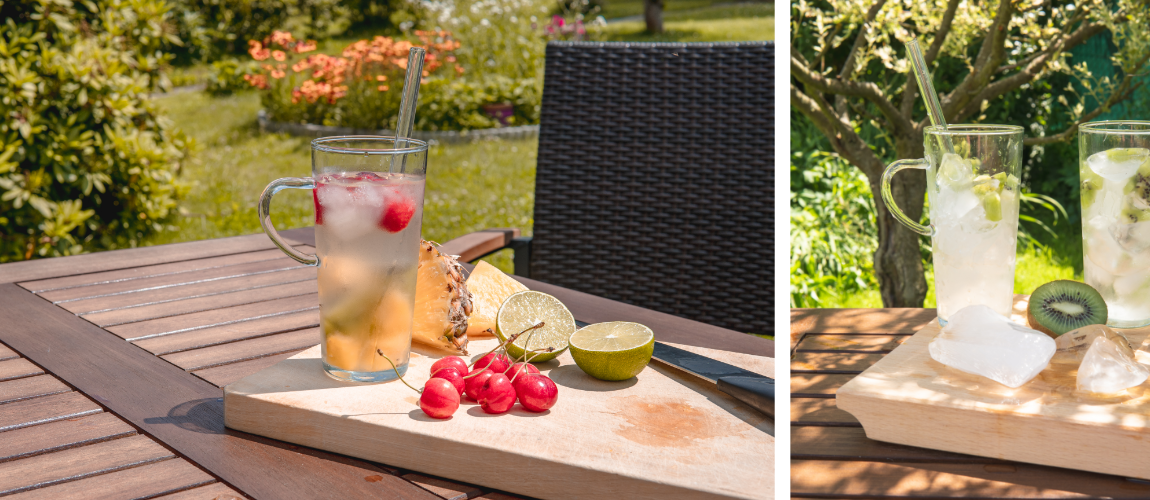 Sklenice SIMAX Karina se studenou vodou, ovocem a skleněným brčkem uvnitř na dřevěném zahradním stole
