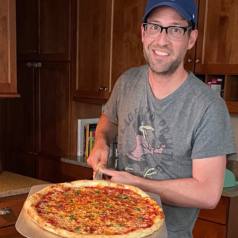 Dan Holds a Pizza