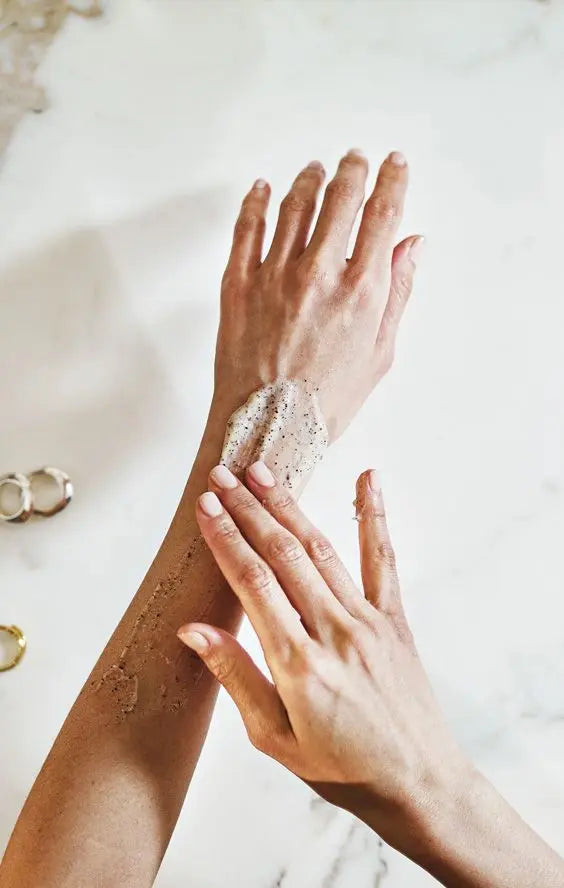 Woman exfoliating her hands