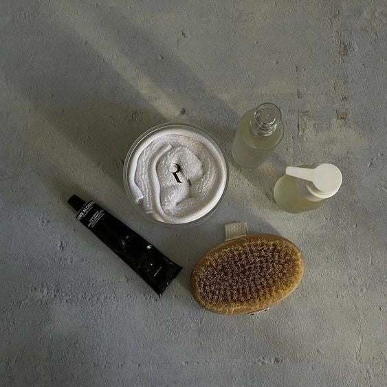 skincare products on concrete floor