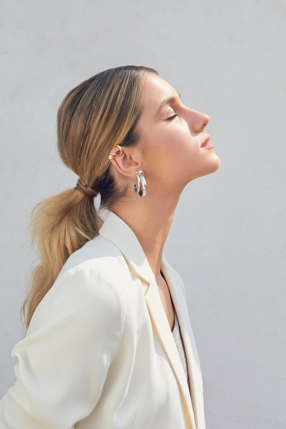 girl-with-a-ponytail-and-earring-seen-from-profile