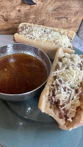 image of french onion sandwich and au jus