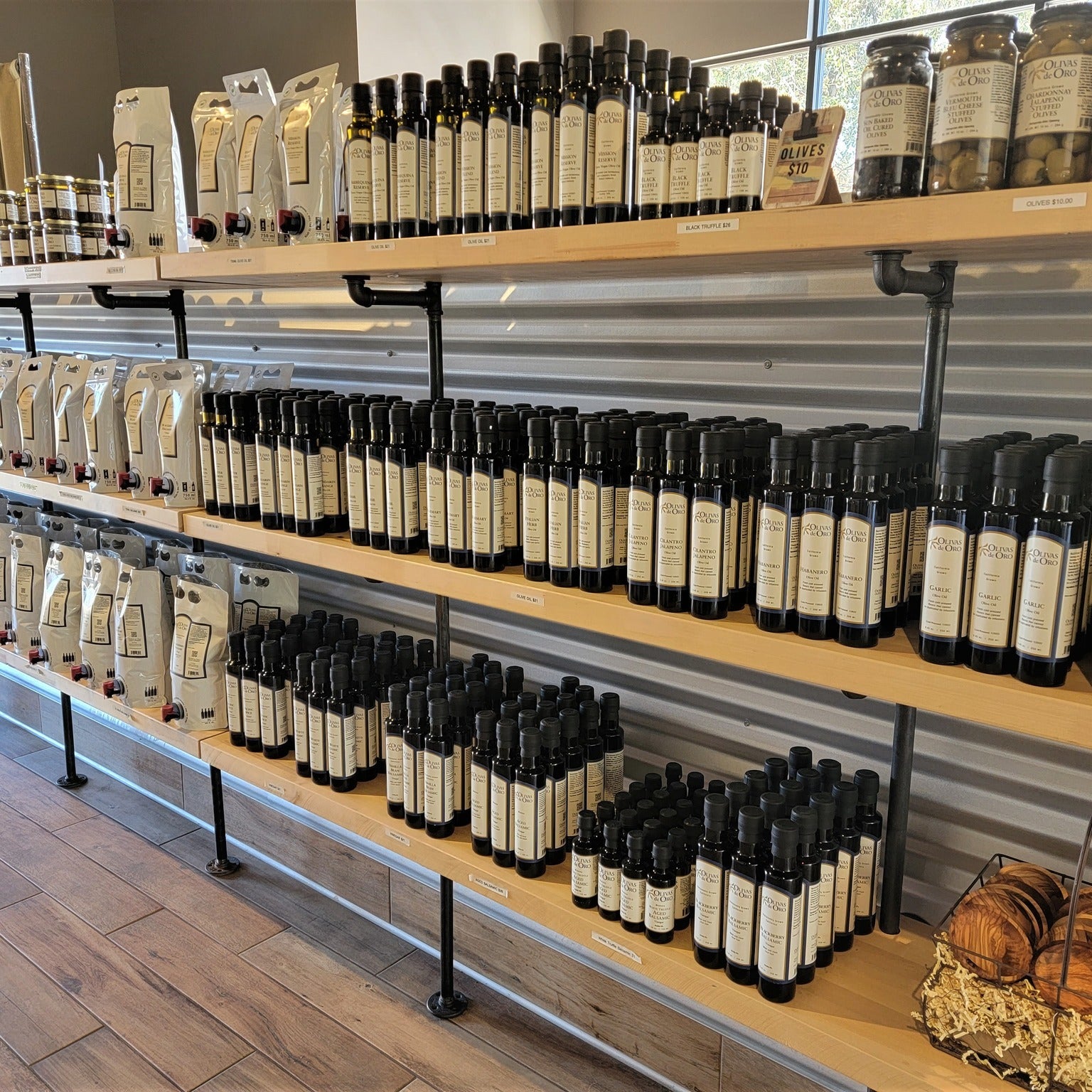 Shelf of olive oil in Olivas de Oro