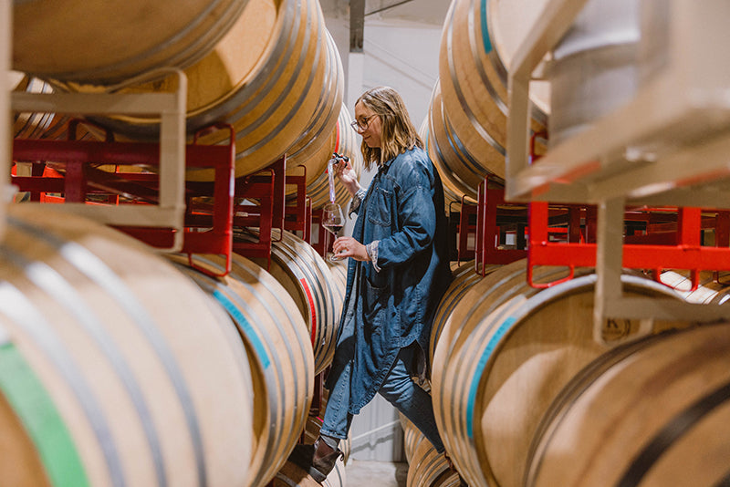 Hubba Wines owner and Winemaker Riley Roddick with barrels