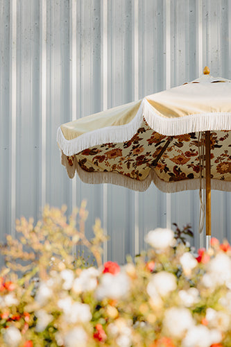 Hubba Wines flowers and umbrellas on the patio