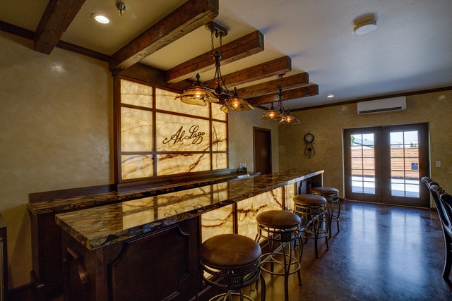 Al Lago tasting room bar with backlit Onx details