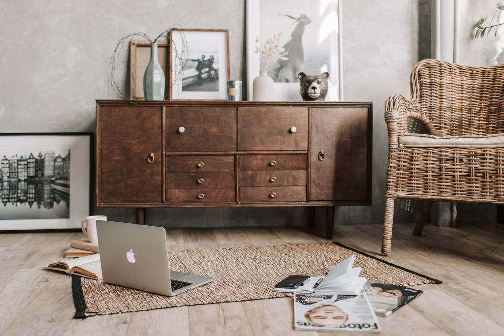 Wooden Cabinets with Drawers, Wooden Rattan Chairs , Classical Straw Rugs ,Apple Laptop and The Decoration:Vase,Frames and Books