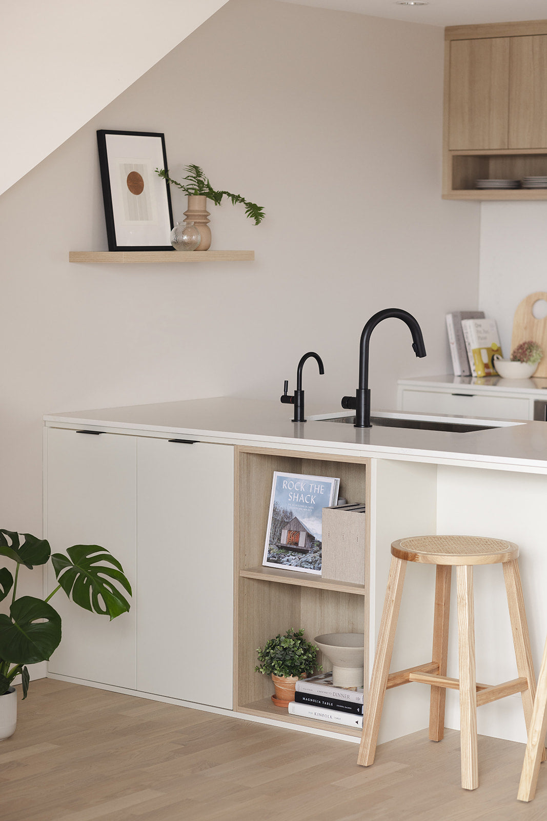 off white flat front swede kitchen with matte black hardware wood accents designed by studio hemma