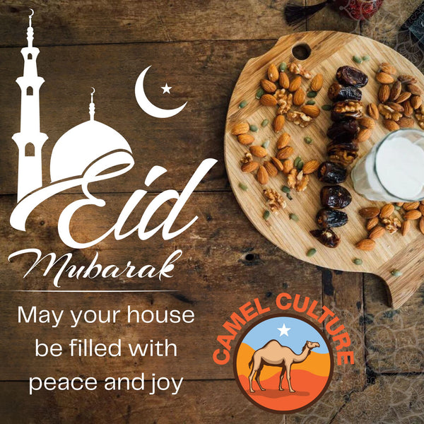 Eid Mubarak greeting from Camel Culture that has camel milk, dates, and nuts on a platter.. It has a blessing written in the bottom left corner that states "May your house be filled with peace and joy."